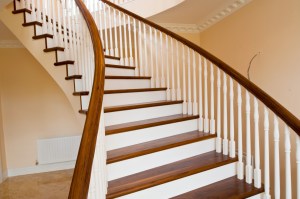 Walnut curved staircase - Walnut Treads & Handrail | Cream Risers, Balusters & Newel Posts | Lacquer | Photo by Kevin McFeely