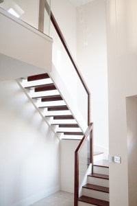 Walnut and cream modern style staircase - Walnut | Cream Strings | Glass Balustrade | Downstand Riser | Winderbox | Square Handrail