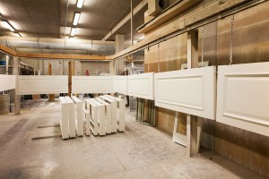 Wooden frames and interior doors hanging in factory