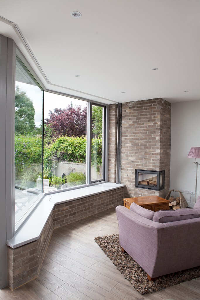 Wall window screen with interior window sill and seating - brick half wall