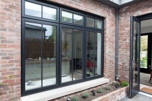 Courtyard casement style window and bi-fold door - Accoya | Double Glazing | RAL 7021 Black Grey | Duplex Glazing with Fused on Glazing Bars