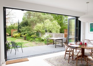 opened bi-fold door - outdoor - black door frame - open plan