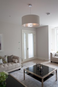 Lounge area with glass transom door and sidelite window - black glass coffee table