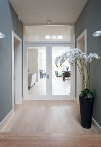 Double doors and fanlight - hallway transom view - glass door - white door frame - tall orchid