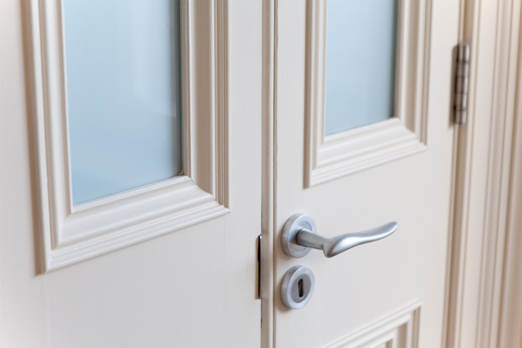 Half size double doors - silver door handle and key hole cylinder - white transom double door