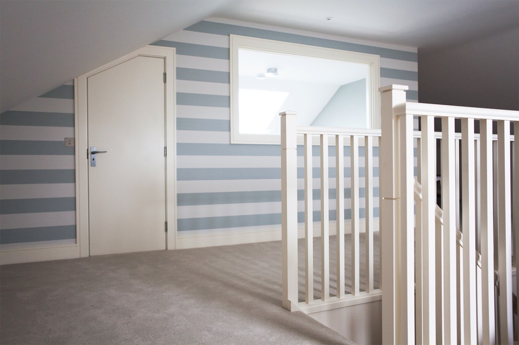 Flush door, internal attic window and landing - white baluster - striped walls