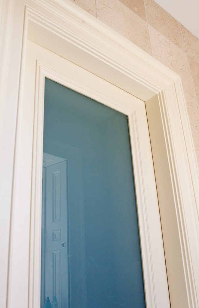White opal glass in bathroom screen - white window frame and casing