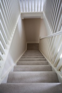 Attic staircase and landing return - carpet stair tread - white staircase baluster