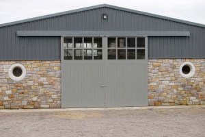 Sliding barn door - double door - stone wall - oversized stable doors - transom windows - sheeting