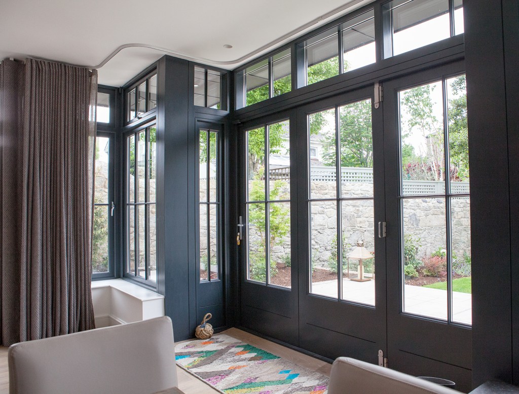 Three leaf bi-fold door - Iroko | Anthracite Grey RAL 7016 | Duplex Glass with Plant on Glazing Bars | 2 Fixed Sashes and 2 Opening Top Sashes | 5 Point Locking System | Stainless Steel Handles