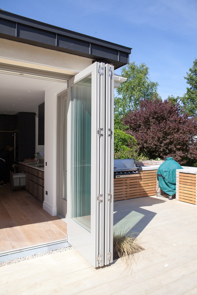 Bi-folding leaves in open position - Accoya | RAL 7030 to outside | Grey to Inside | Centor E3 Sliding Gear | Shaker Style Doors | Side Double Doors | Satin Chrome Fab and Fix Handles