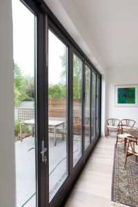 Black frame glass bi-fold door