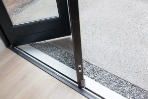 Bi-fold door with black frame and silver door rail