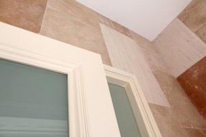 Sandblasted glass - transom door with white frame - tiled wall