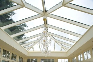 chandelier hanging from roof window - ceiling light - natural light - roof lighting