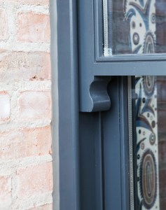 double hung window detail - black window frame and casing - brick wall