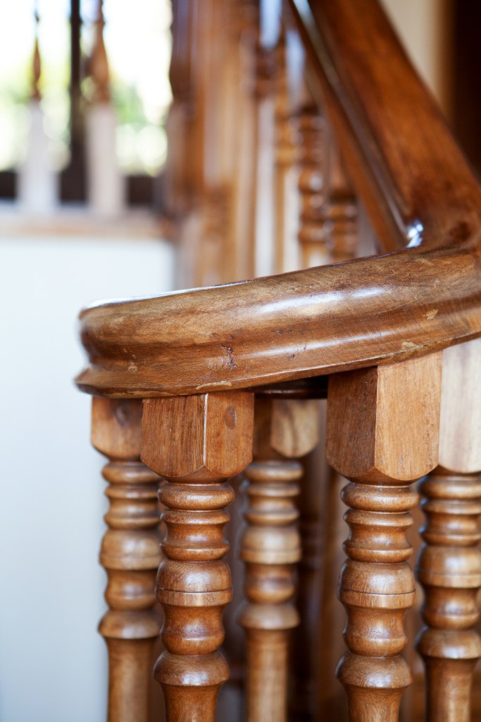 wooden staircase handrail - wooden stair baluster - curved wood - end of rail
