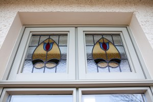 Stained glass with tulip shape and decor - blue, red, yellow and black stained glass