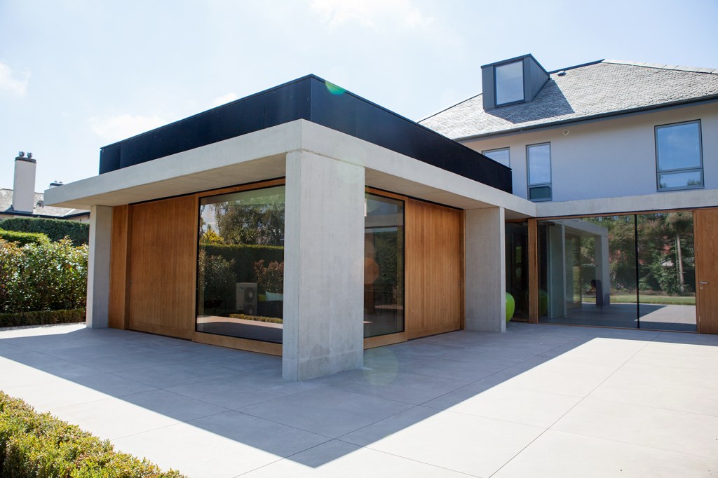 Wall windows with sheeted wood wall and cement pillars