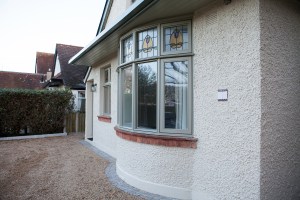 Curved windows with stained glass fanlight windows - brick window sill and bottom rail