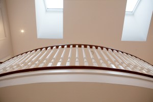 Skye light from ceiling windows - indoor balcony handrail - balcony bannister - white wood balustrade - dark wood skirting
