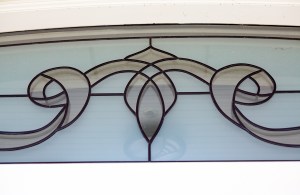 Detail and close up of arched stained glass