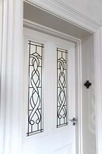 White door with stained glass windows - white casing and door frame