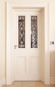 White door - white door casing and door frame - stained glass panels - white wood door panel - door frame