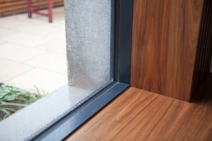 Wooden window sill - black window frame - corner view