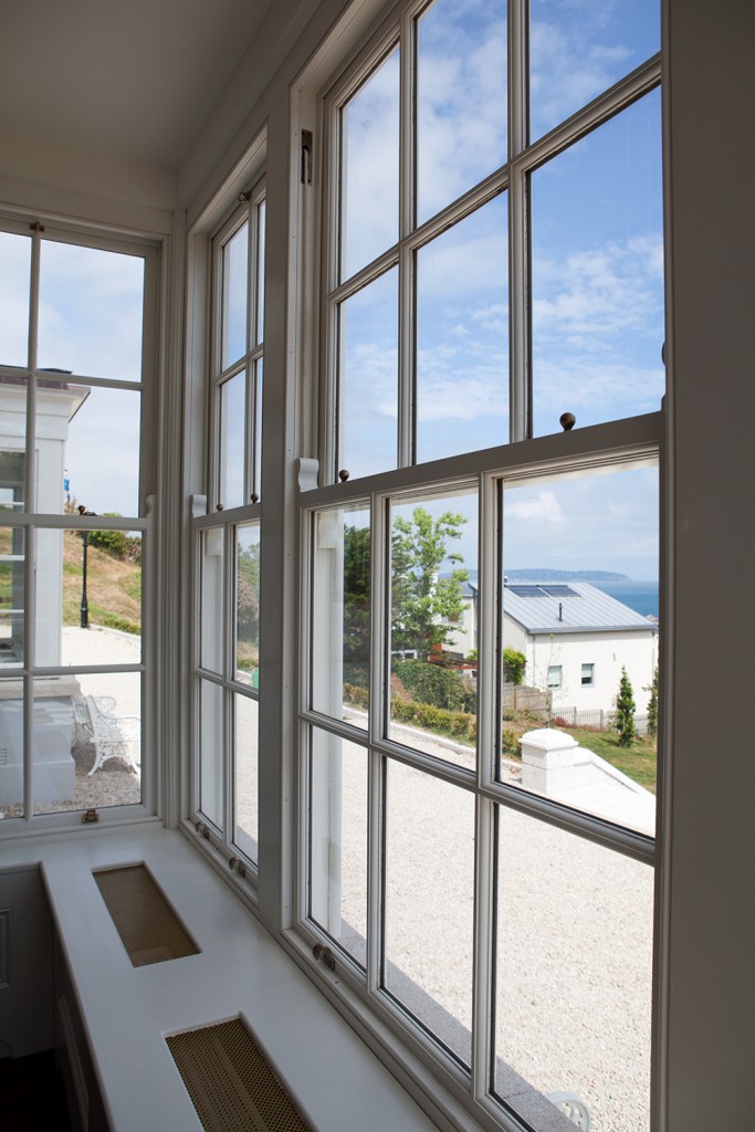 Double hung window - white window frame and grilles - window bench -