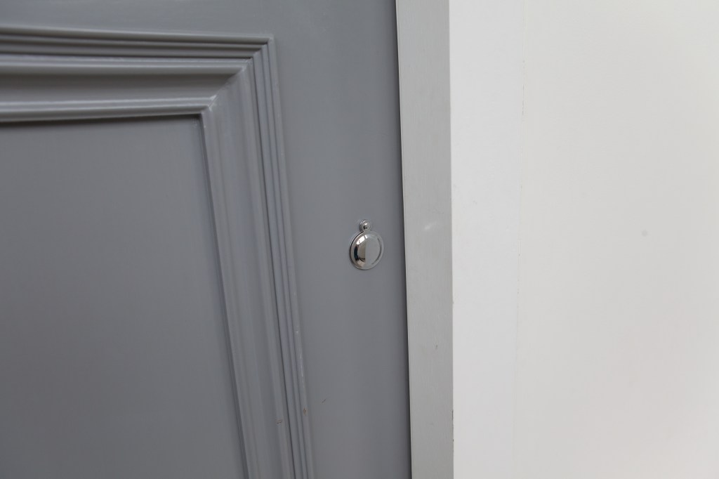 Dark grey door - white wall - silver hidden key cylinder