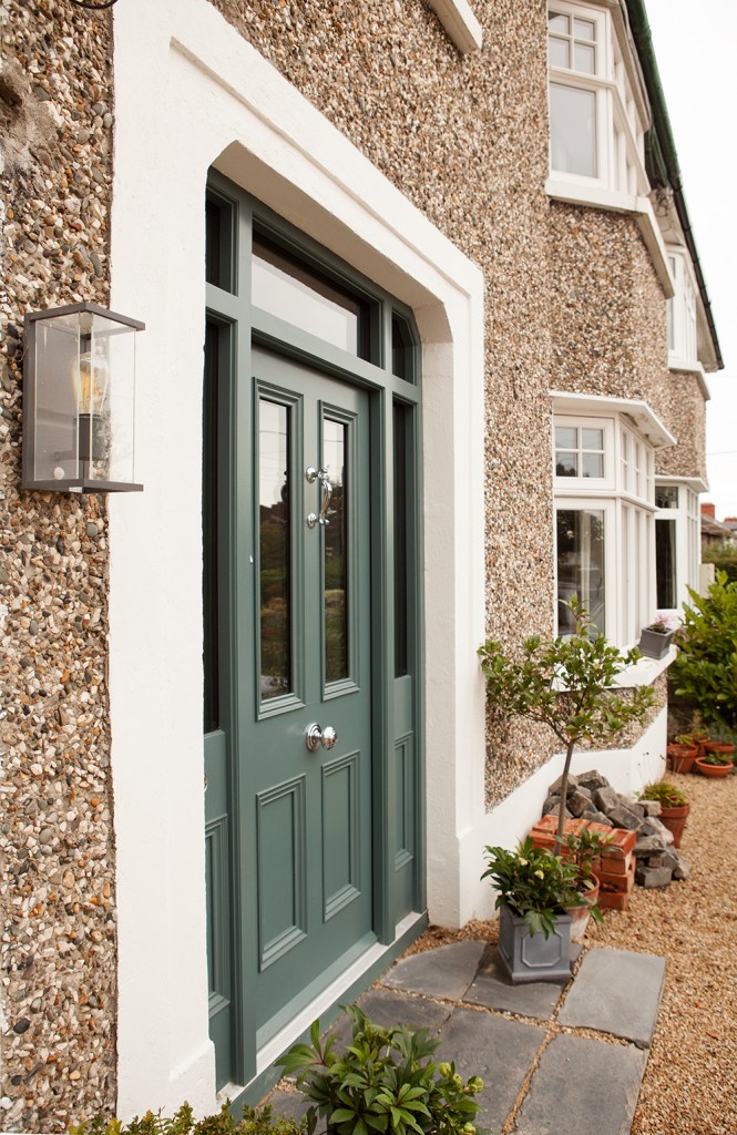 Side view of house - white frame - door with windows