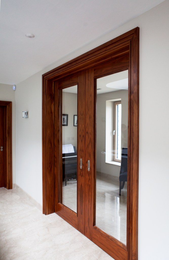 closed sliding door - pocket sliding door - doorlight - glass in door - stained wood frame