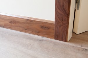 Wood skirting and door frame - laminated floor