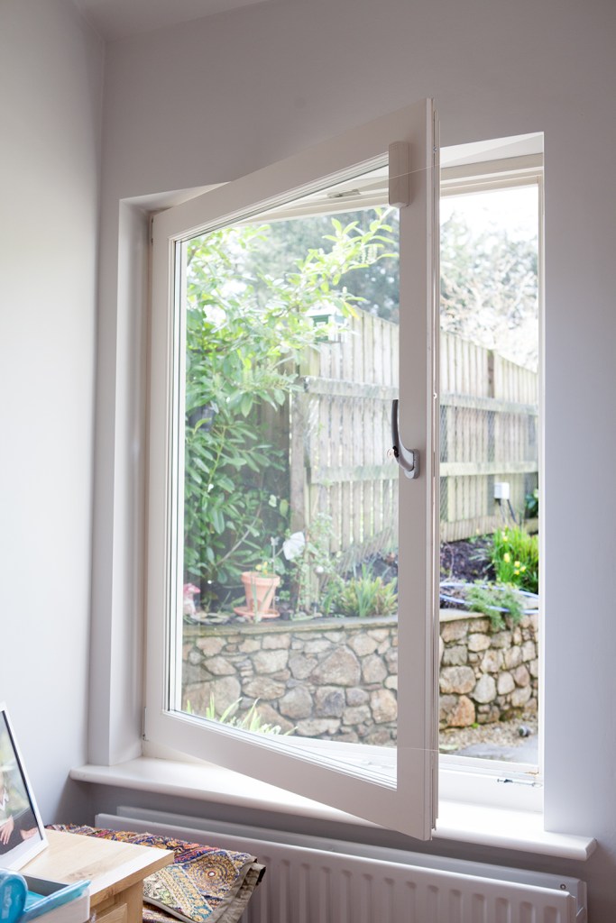 Open glass window - glass panes - window handle - white window frame