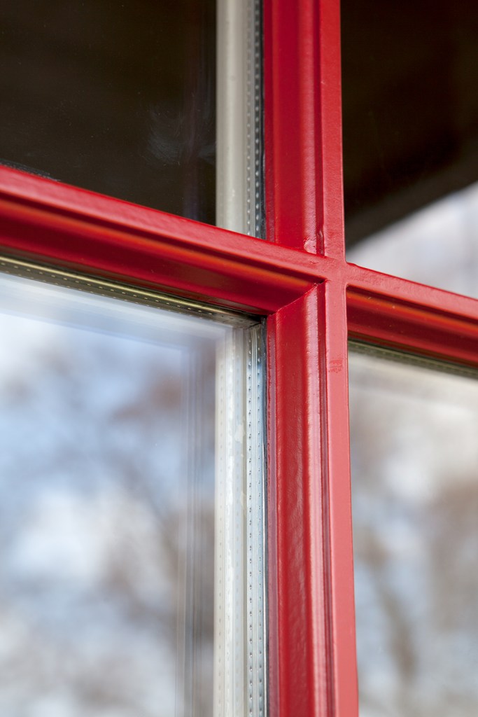 Red grille detail on door - transom door - red frame