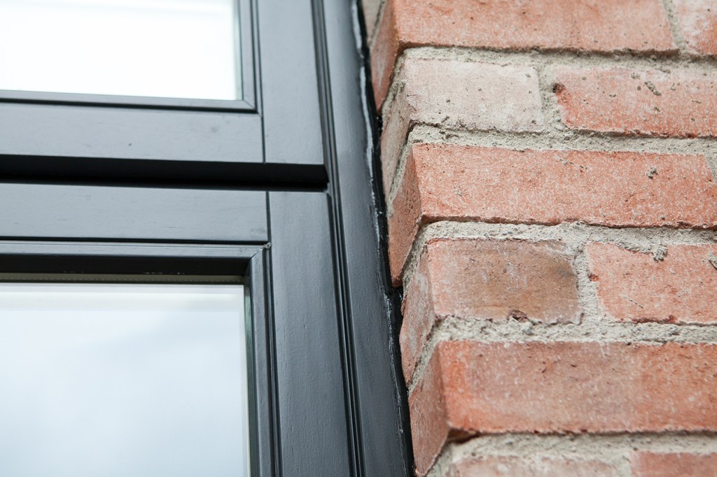 Black window frame - brick wall - brick wall arch