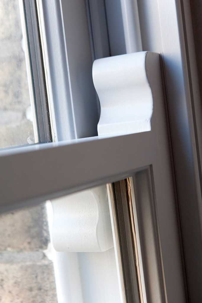 double hung window detail - sliding window up and down - carved wood - white window frame