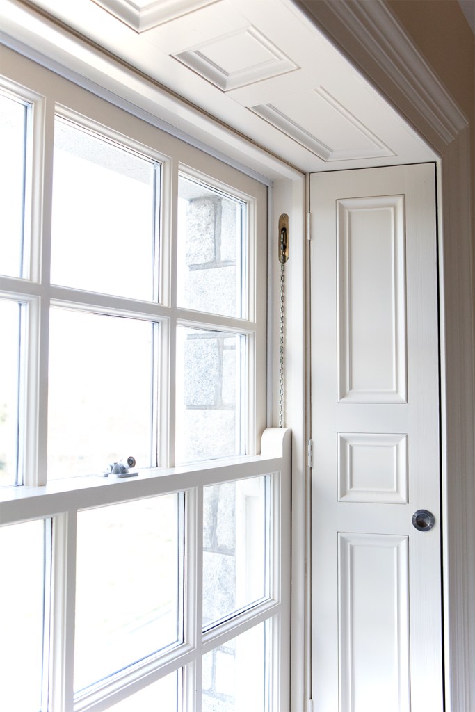 white double hung windows - white window frame - window nook - white window casing -white panels