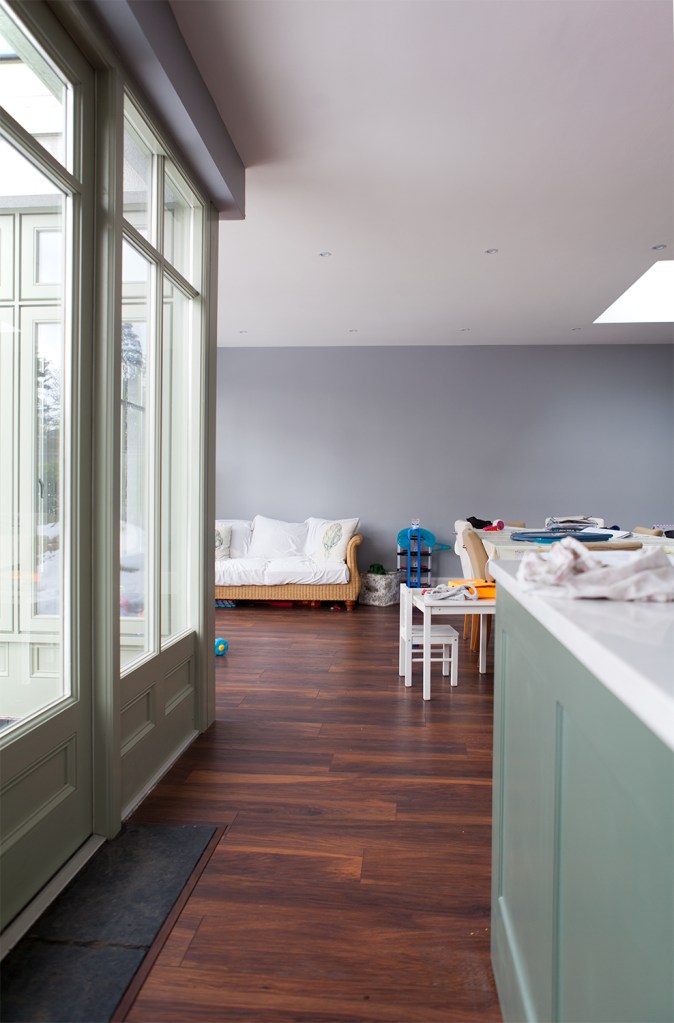 fanlight windows - big clear windows - window frames - counter top - wooden floors - lounge area