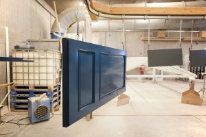 Dark blue door hanging on chain