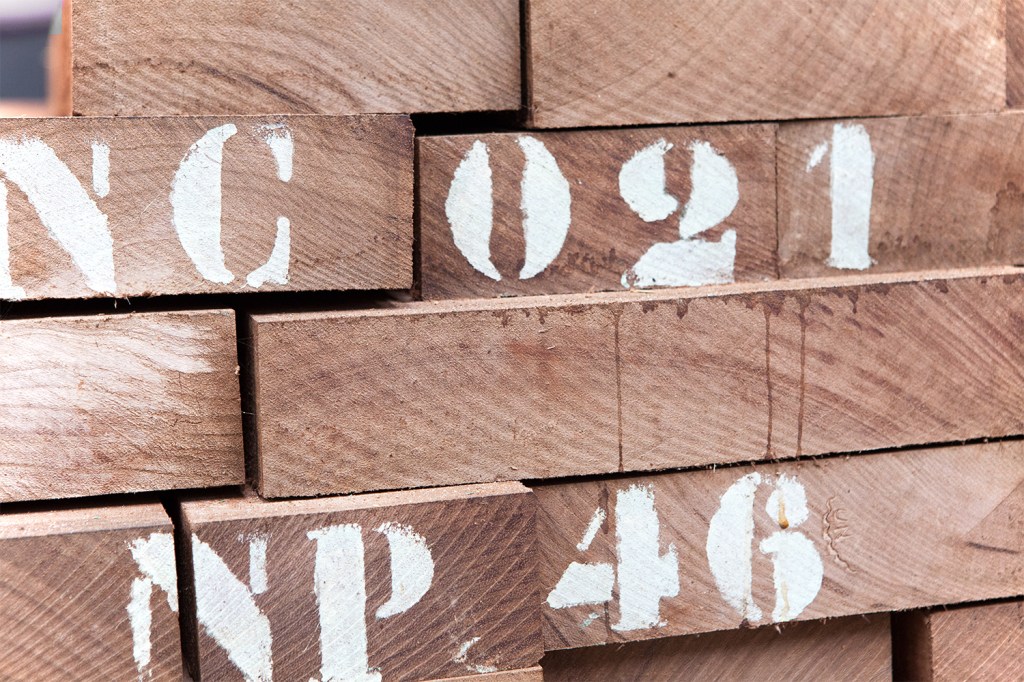 Timber stacked - with letters and numbers painted on timber